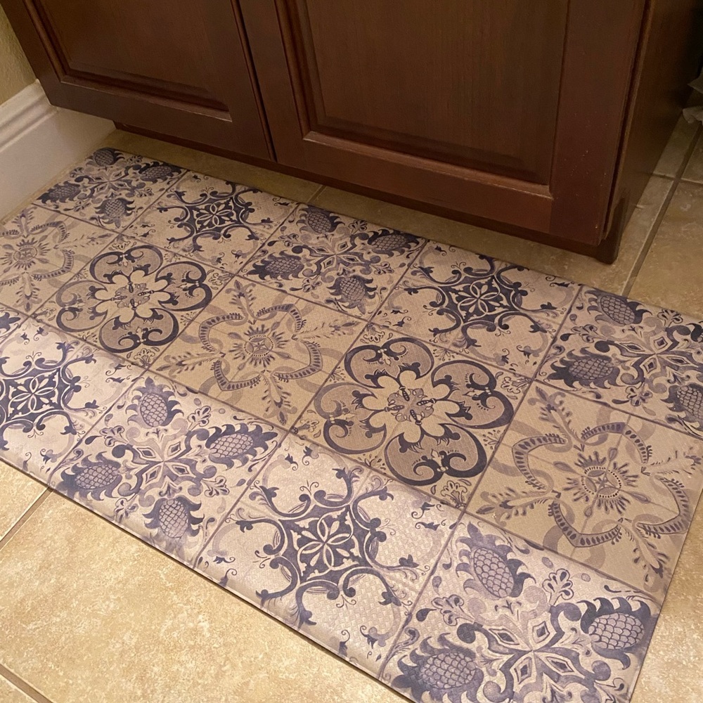 Cat Cora. 20 by 39 inches big. Anti fatigue mat. Use it anywhere.